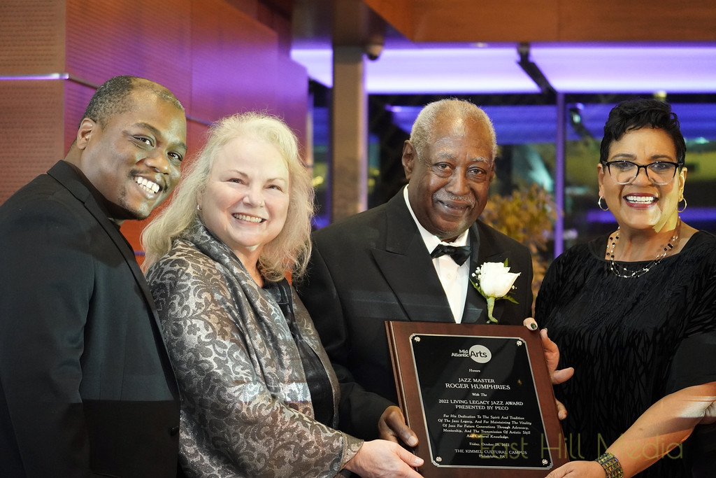 Left to right Napoleon Gladney, Senior Programming Manager, Kimmel Cultural Campus; Theresa Colvin, Executive Director, Mid Atlantic Arts; Roger Humphries, 2022 Living Legacy Jazz Award Presented by PECO Honoree; Romona Riscoe Benson, Mid Atlantic Arts Board Chair and the Director of PECO Corporate and Community Relations. Mr. Humphries holds the 2022 Living Legacy Jazz Award Presented by PECO plaque.