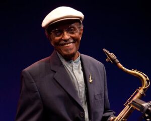 Color photo of Jimmy Heath with his saxophone.