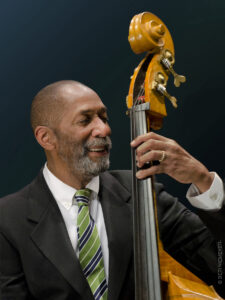 Color photo of Ron Carter playing his bass.