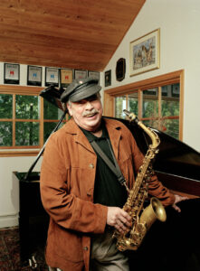 Color photo of Phil Woods with his saxophone.