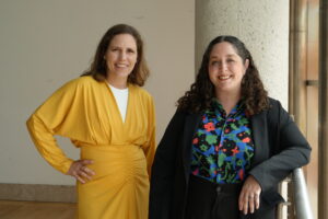 María C. Gaztambide and Annie Y. Saldaña are photographed on a building balcony.